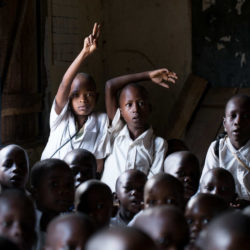 Students in back raising hands